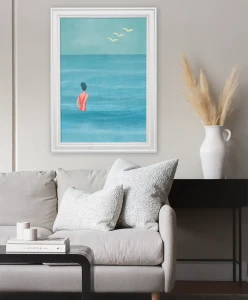 Lato nad morzem - aranżacja plakatu w salonie nad kanapą