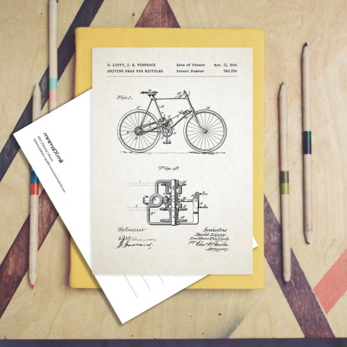 Rower patent -  aranżacja pocztówki na stole